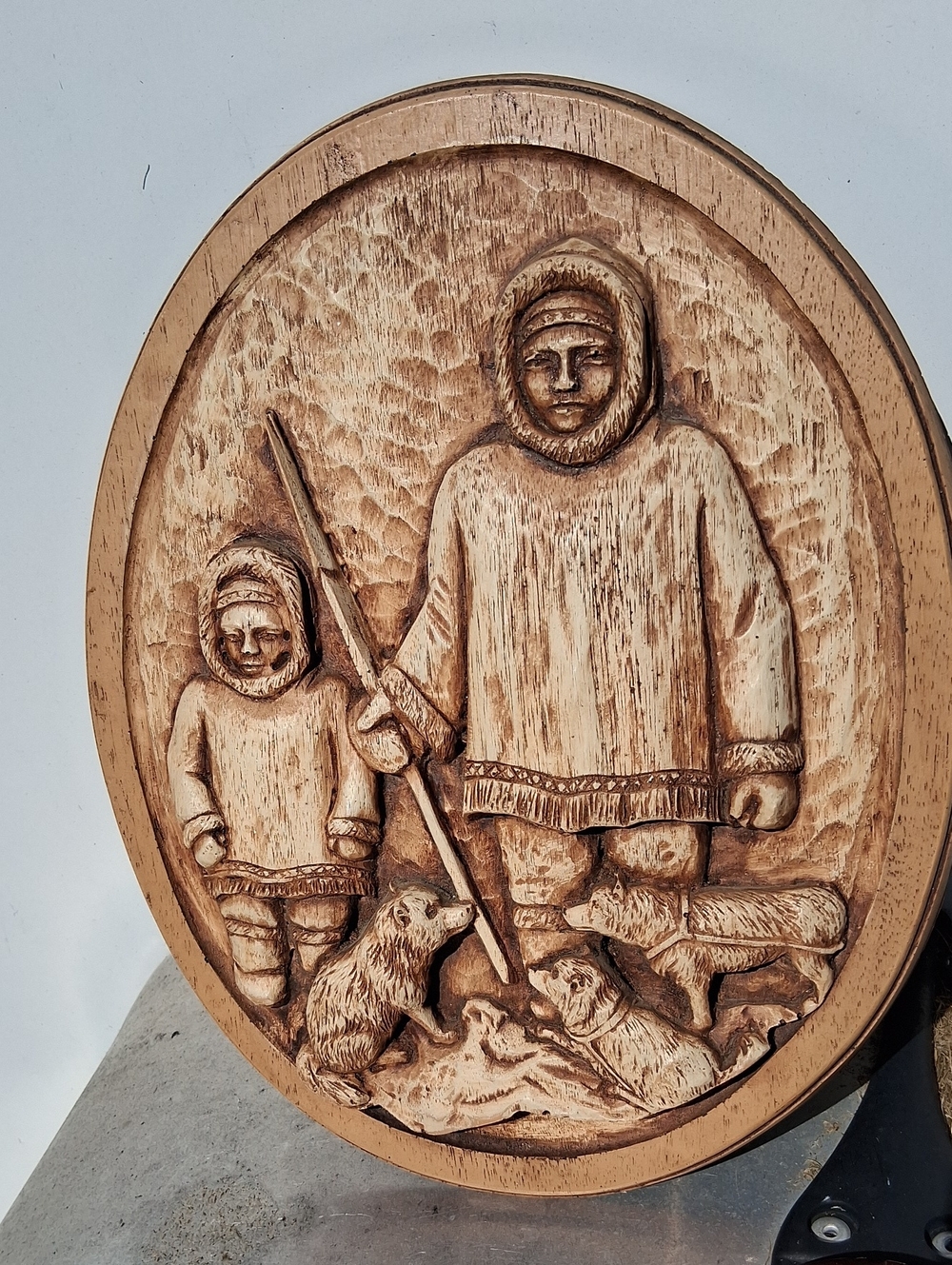 734
Karl Rothammer round wooden plaque sculpture Inuit life